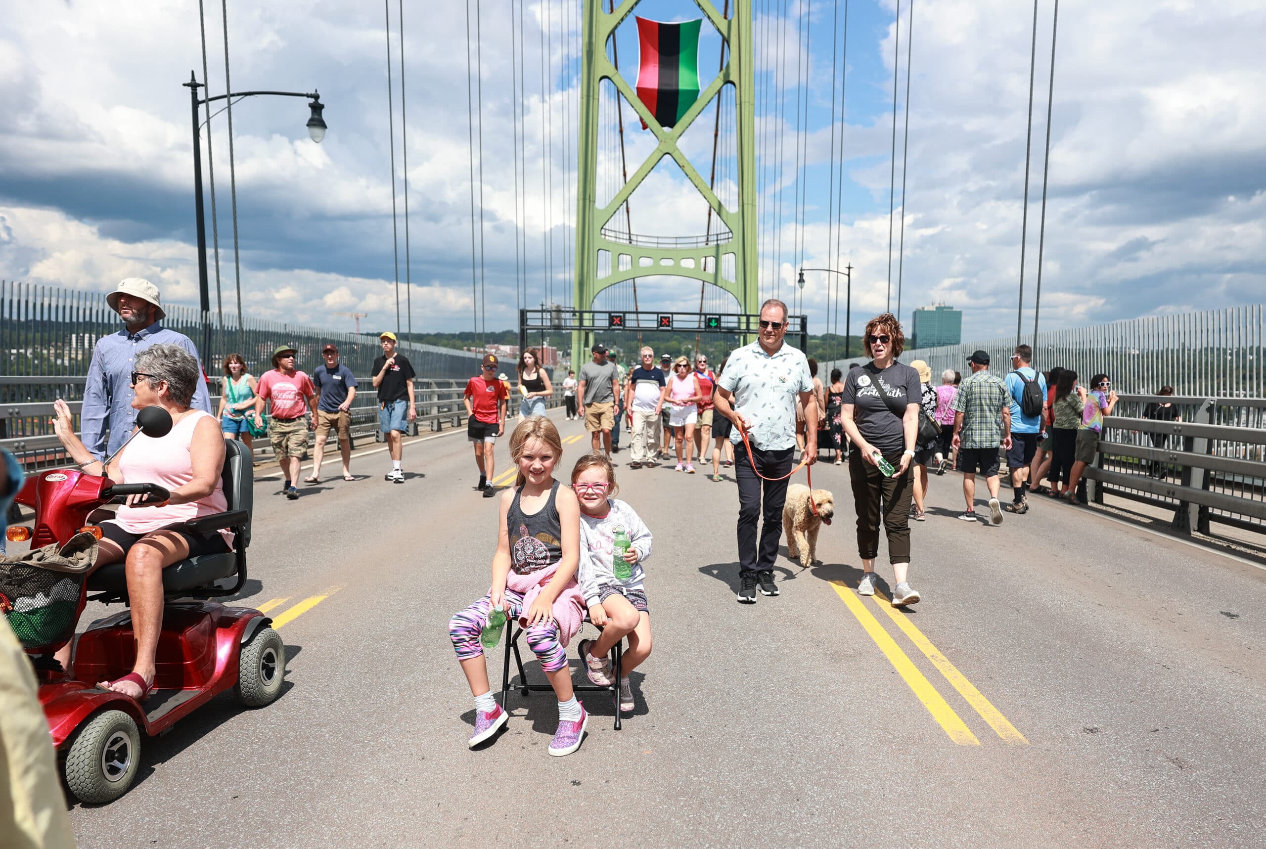People walk on the Macdonald Bridge during Bridgewalk 2023.
